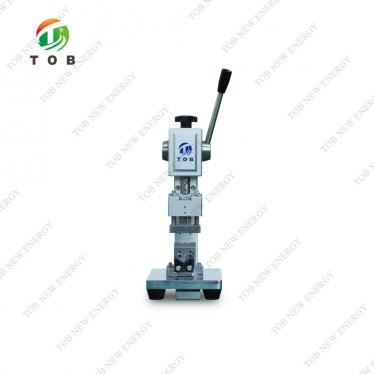 Machine à perforer les onglets